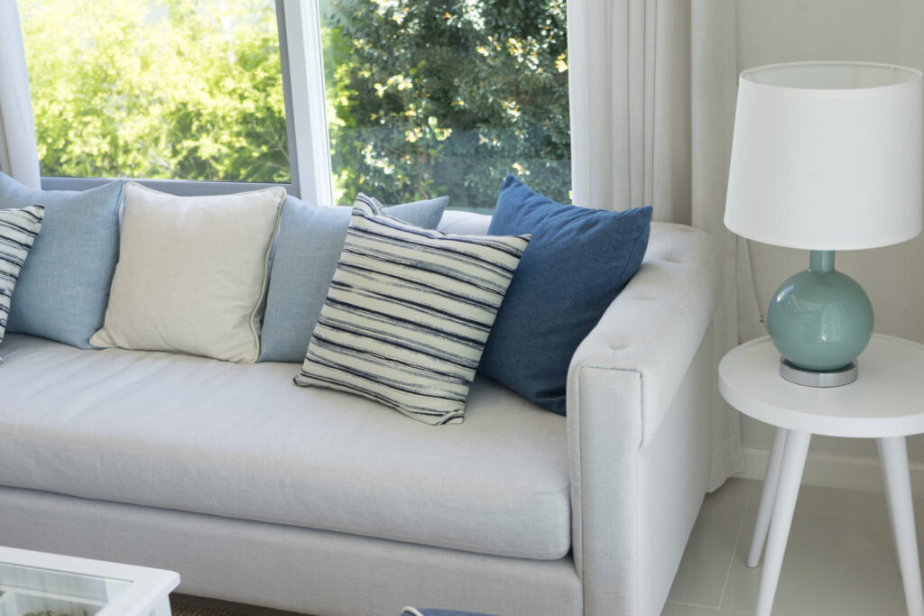blue cushion and sofa