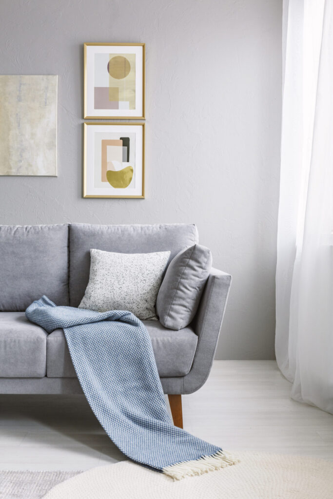 Blue blanket on grey couch